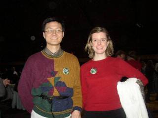 Kelly and Brian hold hands and pose for the picture.